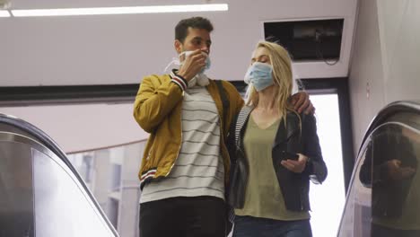 Caucasian-couple-on-the-go-wearing-a-coronavirus-covid19-mask