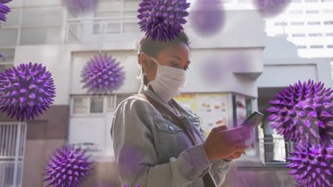 Animation-of-macro-coronavirus-Covid-19-cells-spreading-over-woman-wearing-a-mask-in-the-street