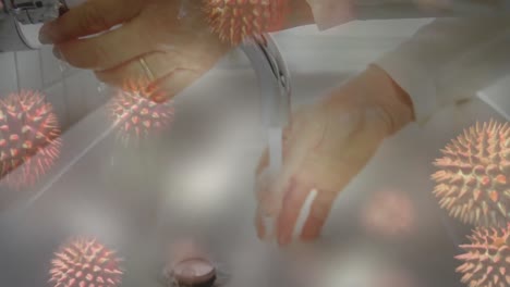 Animation-Von-Makro-Coronavirus-Covid-19-Zellen,-Die-Sich-über-Eine-Kaukasische-Frau-Ausbreiten,-Die-Sich-Die-Hände-Wäscht