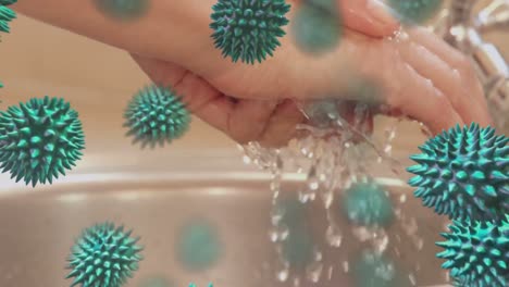 Animation-Von-Makro-Coronavirus-Covid-19-Zellen,-Die-Sich-über-Eine-Frau-Ausbreiten,-Die-Sich-Die-Hände-Wäscht