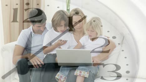 Animation-of-a-Caucasian-couple-and-their-children-using-a-laptop-computer-with-the-a-clock