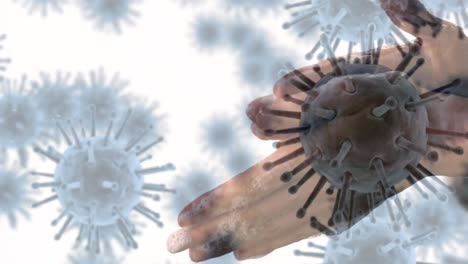 Animation-Von-Makro-Coronavirus-Covid-19-Zellen,-Die-Sich-über-Einen-Mann-Ausbreiten,-Der-Sich-Mit-Flüssigseife-Die-Hände-Wäscht