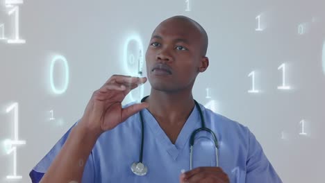 Animation-of-binary-coding-processing-over-African-American-male-doctor-holding-a-syringe-in-the-bac
