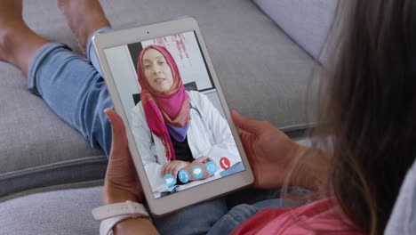 Woman-talking-on-video-meeting-on-her-digital-tablet