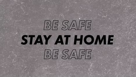 Words-Be-Safe,-Stay-At-Home-written-in-black-and-green-letters-on-grey-background.-
