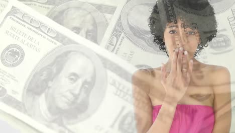 Animation-of-a-woman-covering-her-mouth-over-American-dollar-bills-spinning.-