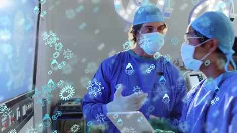 Animation-of-surgeons-with-protective-masks-and-suit-over-multiple-virus-and-bacteria-icons