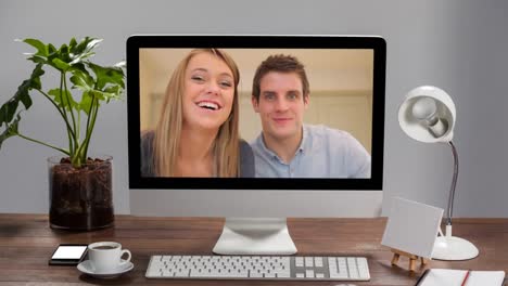 Animation-of-a-computer-monitor-showing-Caucasian-couple--on-the-screen.