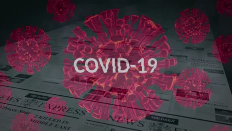Animation-Eines-Wortes-„Covid-19“-Mit-Zellen,-Die-über-Einer-Zeitung-Schweben