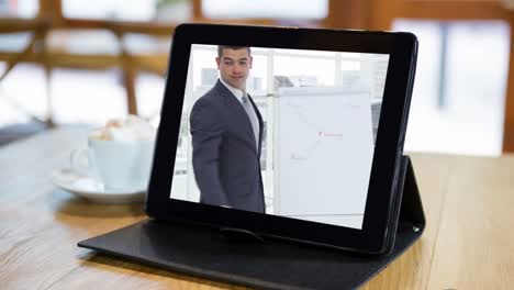 Animation-of-a-digital-tablet-with-a-Caucasian-businessman-on-the-screen