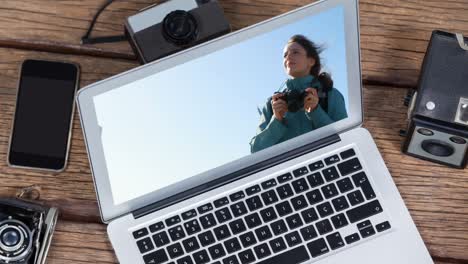 Animation-of-a-laptop-showing-Caucasian-woman-on-the-screen