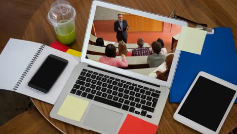 Animation-of-a-laptop-showing-multi-ethnic-group-of-students-on-the-screen