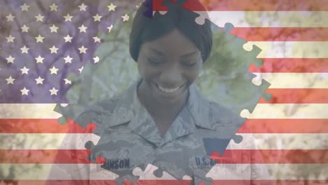 Animation-of-U.S.-flag-formed-with-puzzle-pieces-opening-over-woman-wearing-military-uniform