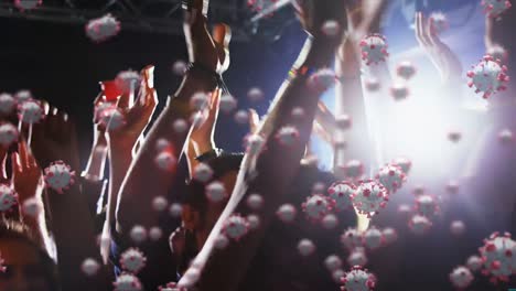 Animation-of-macro-Covid-19-cells-floating-over-a-group-of-people-partying-at-a-concert
