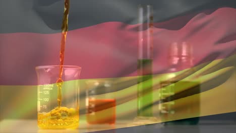 Animation-Einer-Flüssigkeit,-Die-In-Ein-Reagenzglas-Fällt,-über-Einer-Wehenden-Deutschen-Flagge
