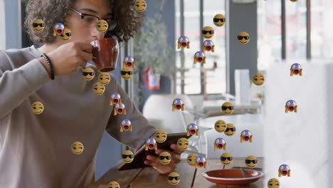 Emojis-moving-against-man-drinking-coffee
