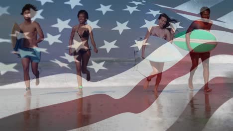 Multi-races-friends-at-the-beach-with-US-flag-waving-foreground