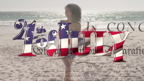 Young-mixed-race-woman-holding-US-flag-with-independence-date-and-declaration-foreground