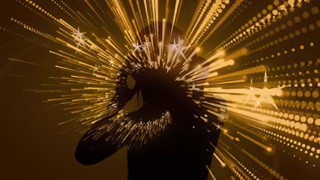Digitally-generated-video-of-light-trails-moving-against-silhouette-of-woman-dancing-with-headphones