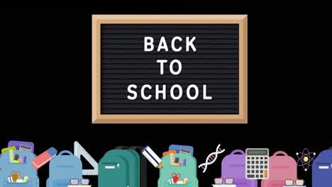 Text-„Willkommen-Zurück-In-Der-Schule“-Auf-Der-Tafel-Vor-Schulsymbolen