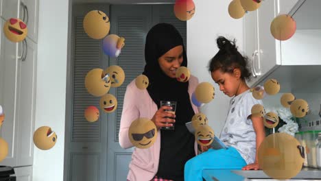 Face-emojis-moving-against-woman-in-hijab-talking-to-her-daughter