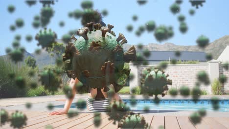 Digital-composite-video-of-Covid-19-cells-moving-against-woman-sitting-by-a-pool-in-background