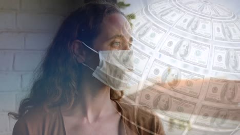 Digital-composite-video-of-globe-made-of-American-dollar-bills-spinning-against-woman-wearing-a-face