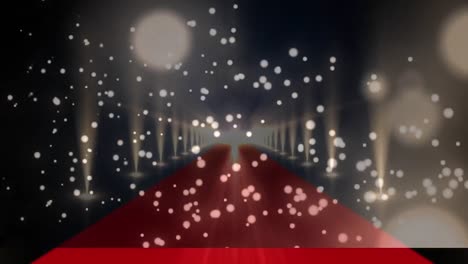 Digital-composite-video-of-golden-glowing-spots-moving-against-red-carpet-with-lights-flashing