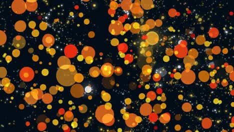 Digitally-generated-video-of-yellow-and-orange-glowing-spots-moving-against-black-background