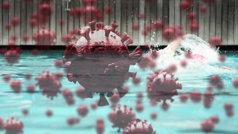 Digitales-Zusammengesetztes-Video-Von-Covid-19-Zellen,-Die-Sich-Gegen-Einen-Mann-Bewegen,-Der-Im-Pool-Im-Hintergrund-Schwimmt