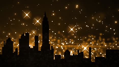 Yellow-sparkles-and-glowing-spots-moving-against-silhouette-of-cityscape-in-background-