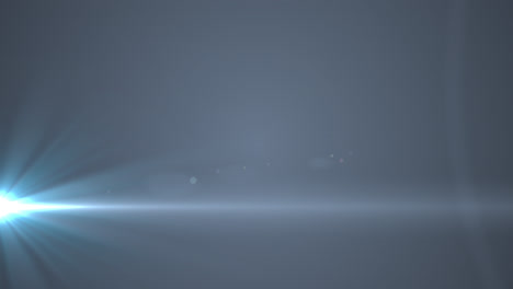 Glowing-blue-rays-of-light-moving-against-grey-background