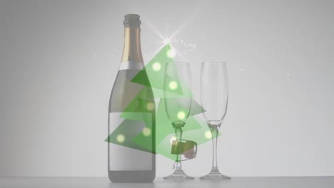 Digital-composite-video-of-christmas-tree-made-of-green-triangles-against-bottle-of-champagne