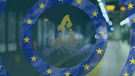 Digital-composite-video-of-EU-flag-and-map-moving-against-empty-subway-station-in-background