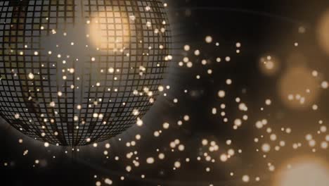 Golden-disco-ball-and-glowing-spots-against-golden-background