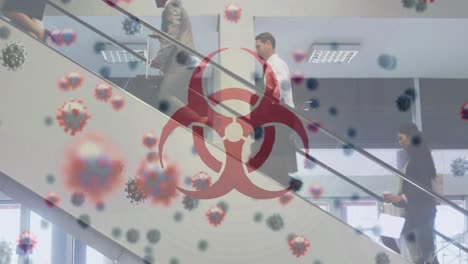 Animation-of-biohazard-symbol-and-floating-Covid-19-cells-over-people-walking-at-airport