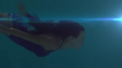 Animation-of-woman-swimming-with-glowing-blue-light-moving-in-the-foreground