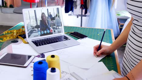 Female-designer-having-a-video-conference-