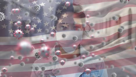 Covid-19-cells-and-woman-wearing-face-mask-against-US-flag-waving