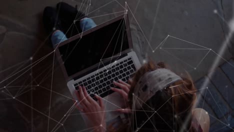 Network-of-connections-against-a-schoolgirl-using-laptop