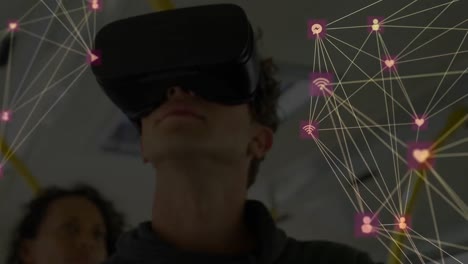 Globe-of-network-of-connections-against-man-using-VR-headset