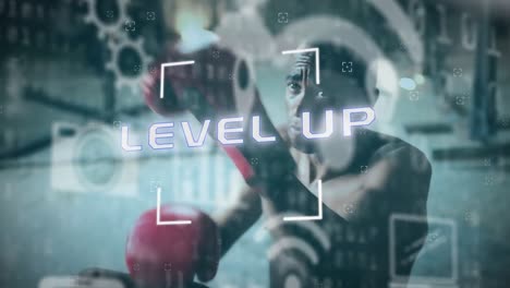 Level-up-text-and-digital-icons-against-male-boxer-training-at-the-gym