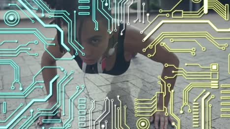 Microprocessor-connections-against-woman-performing-push-up-exercise