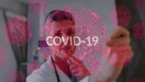 Covid-19-text-over-Covid-19-cells-against-female-doctor-examining-X-ray-