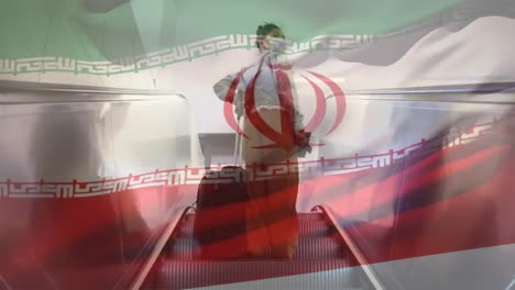 Iranian-flag-waving-against-woman-wearing-mask-on-escalator