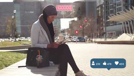 Digitale-Symbole-Mit-Steigender-Zahl-Auf-Einer-Sprechblase-Gegen-Eine-Frau-Im-Hijab,-Die-Ihr-Smartphone-Benutzt