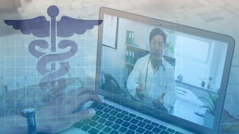 Asclepius-symbol-over-man-doctor-on-laptop-screen.