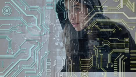 Circuit-connections-over-female-hacker-using-laptop-against-cityscape