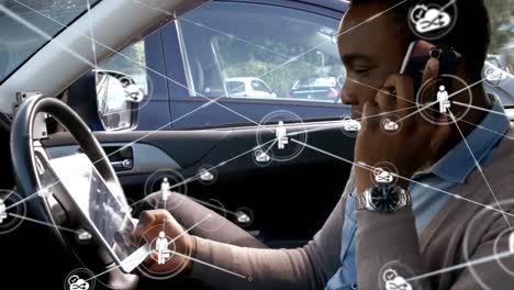 Network-of-connections-against-man-with-digital-tablet-talking-on-smartphone-in-car