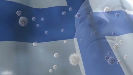 Finnish-flag-waving-against-Covid-19-cells-and-human-head-model-wearing-face-mask